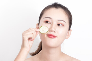 Obraz na płótnie Canvas Model cucumber slices for skin care and hydration