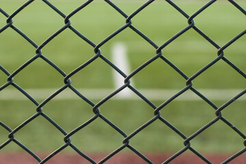 Football field behind wires