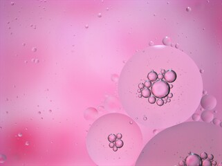 abstract background with pink bubbles oil ,macro image ,blurred sweet color for card design ,bright wallpaper, shiny water droplets