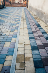 Perspective View Monotone Gray Brick Stone Pavement on The Ground for Street Road. Sidewalk, Driveway, Pavers, green grass