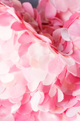 Wavy composition of beautiful pink textile petals