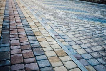 Perspective View Monotone Gray Brick Stone Pavement on The Ground for Street Road. Sidewalk, Driveway, Pavers, green grass