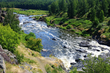 Stone boulders in a mountain river