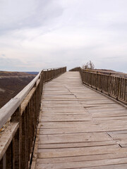 Fototapeta premium Ancient wooden staircase in the medieval fortress 3rd - 7th and 11th - 17th century (East date) Ovech in Provadia, Bulgaria