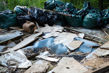 Old broken building materials in nature, demolition waste