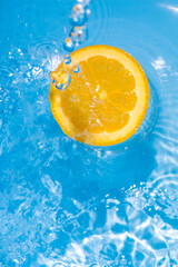 Cool splash orange slice in summer