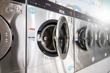 multiple Industrial Washing Machines in Laundry shop, Washing with hot and cold water keeps clothes clean and trendy.
