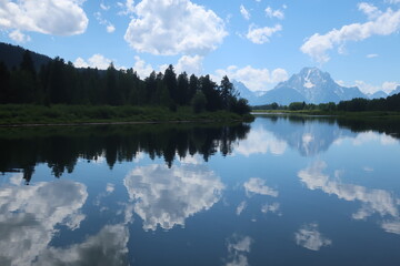 Reflective lake and Mount Moran in the Tetons