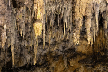 Stalactite decorations in the dark cave