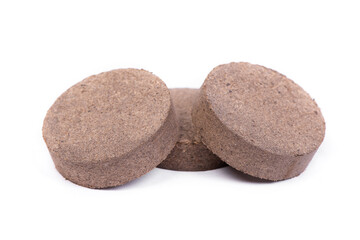 Fototapeta premium Dry peat pellets, compressed compost tablet