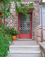 Fototapeta na wymiar old stonewall house entrance door, Athens Greece