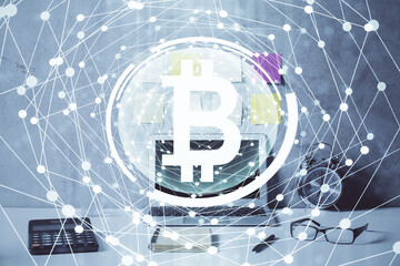 Double exposure of blockchain and crypto economy theme hologram and table with computer background. Concept of bitcoin cryptocurrency.