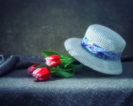 Still life with tulips and woman hat