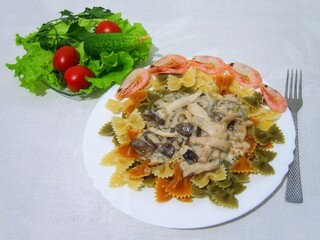 Still life with plate of pasta with seafood and vegetables