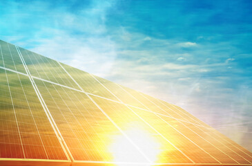 Sunlit solar panels against blue sky. Alternative energy source