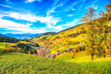 Awesome autumn scene of magnificent  Santa Maddalena village in Dolomites