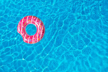 Swimming pool with inflatable ring, top view. Space for text