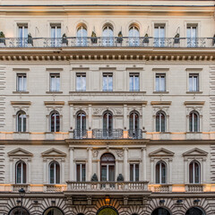 illuminated vintage building facade windows pattern, Rome Italy