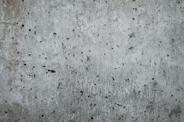 old gray ragged porous concrete wall. rough surface texture