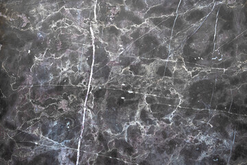 gray marble slab with white curved lines and stains of dirt. rough surface texture