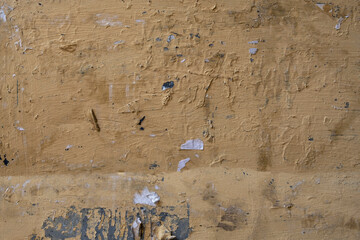 old beige concrete wall with deep relief and scratches. rough surface texture
