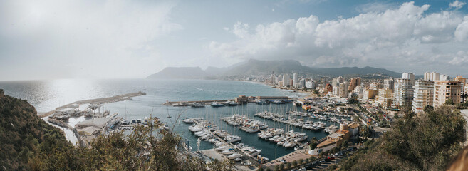 Obraz premium Breathtaking aerial view Calpe, Costa Blanca. Popular summer resort in Spain with mediterranean sea and Las Salinas lake, mountains at the background.