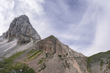 View of Grosse Kinigat/Monte Cavallino mountain and Hintersattel pass as seen from Filmoor / Standschutzenhutte refuge below, Carnic Highroute Trek, Carnic Alps, Austria.