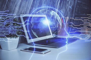 Multi exposure of work table with computer and brain hologram. Brainstorm concept.