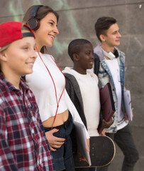 group of teenagers posing and smiling in yard