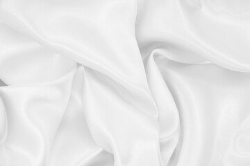 Smooth elegant white silk or satin luxury cloth texture as wedding background. Luxurious background design