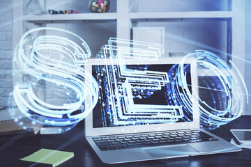 Multi exposure of table with computer and seo drawing hologram. Search optimization concept.