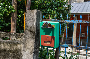 Yunlin, Taiwan - AGU 02, 2019: Green mailbox on the door.