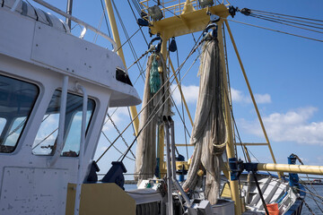 Nets of a Dutch fishing cutter hanging out to dry on deck © Henk Vrieselaar