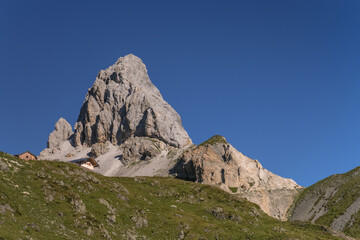 Early [sunny] morning  view of Grosse Kinigat mountain and Hintersattel pass as seen from Filmoor refuge, Carnic Highroute Trek, Carnic Alps, East Tirol, Austria.