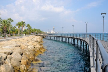 Fototapeta premium View of Limassol promenade with palm trees on a beautiful sunny day in Cyprus