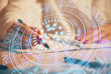 Multi exposure of woman's writing hand on background with data technology hologram. Concept of innovation.