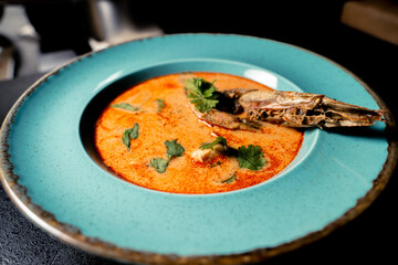 Thai soup Tom Yam with langoustine