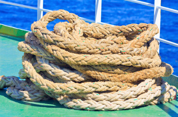 Fototapeta na wymiar Untied rope on ship's deck 