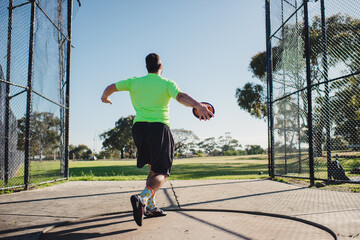 Discus thrower in cage 