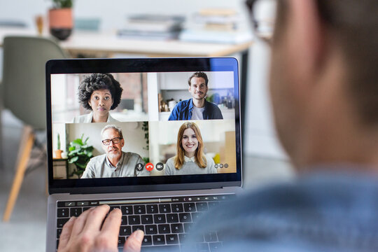 Person Using Video Conferencing technology for business meeting