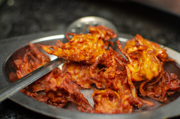 Crispy kanda pakora or kanda bhaji. Mumbai's road side snack. Favourite monsoon snack in India.