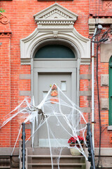 Vintage entry door with Halloween decoration. New York. USA. © alexzosimov