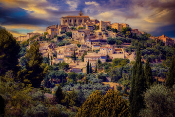 Sunset over the commune of Gordes, in the Vaucluse region of Provence, France