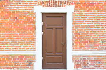 red brick wall with door
