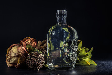Obraz na płótnie Canvas Skull bottle composition with water swirl