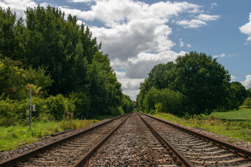 Fototapeta na wymiar Perspective view up a twin track railway in the English countryside