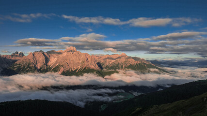 Outstanding early morning view of the Sesto Dolomites in Italy as seen from Sillianer refuge on the Carnic Alps ridge on the Austrian Italian border, Carnic Highroute trek, South Tirol, Austria.