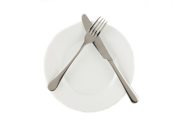 Dining etiquette - I still eat, pause. Fork and knife signals with location of cutlery set. Photo...
