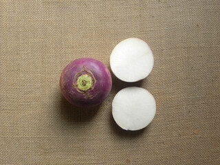 Whole and cut purple and white color ripe Turnip roots