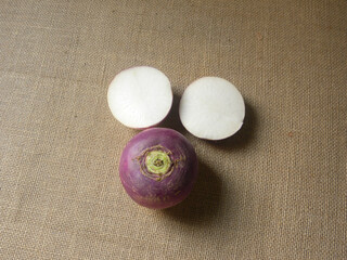 Whole and cut purple and white color ripe Turnip roots